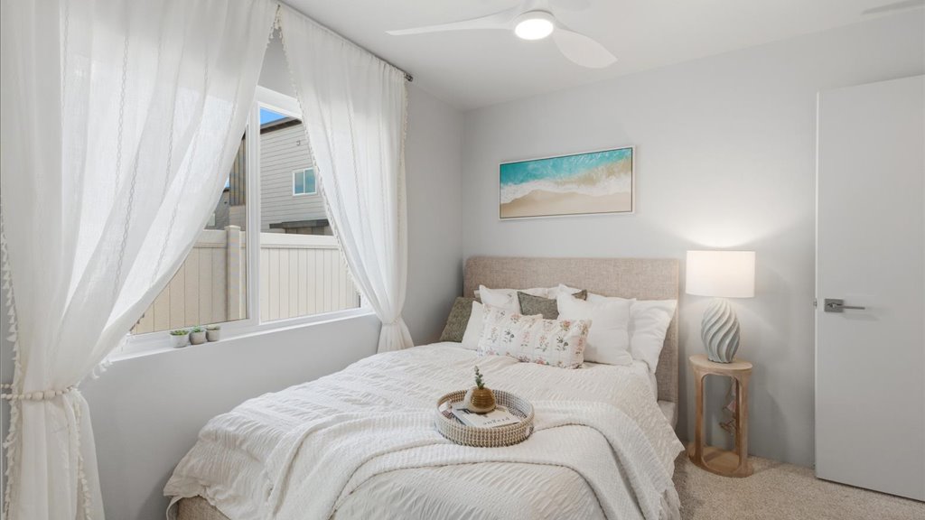 Interior bedroom with sliding door closet and large window