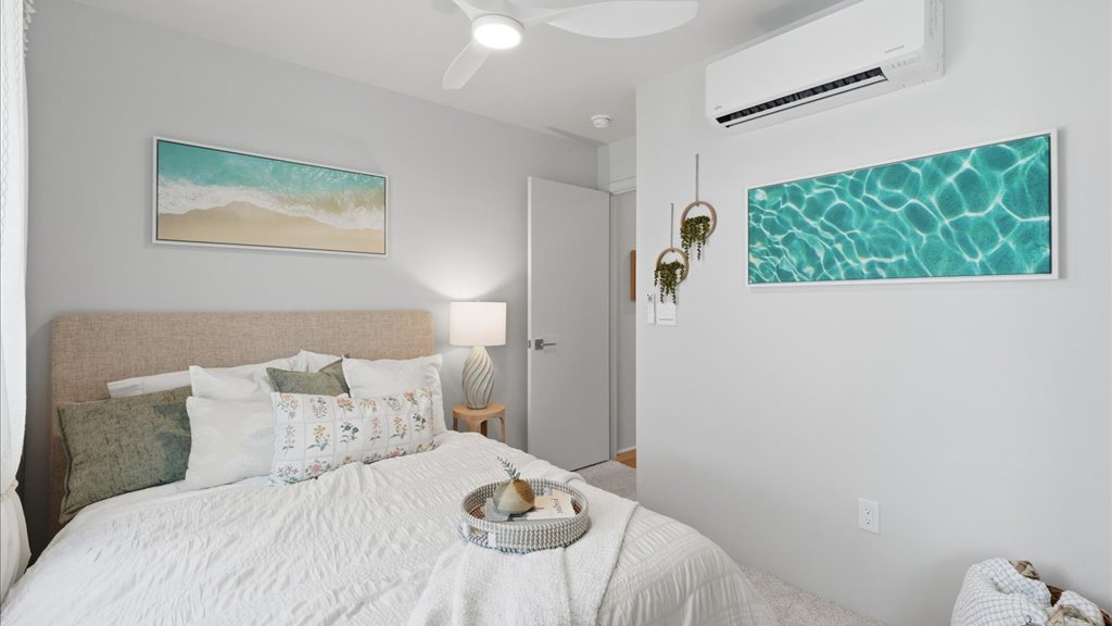Interior bedroom with sliding door closet and large window