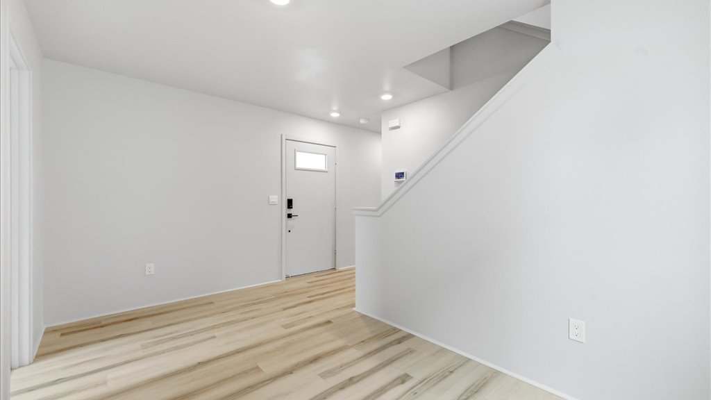 Interior bonus space and play room with large window open to stairs