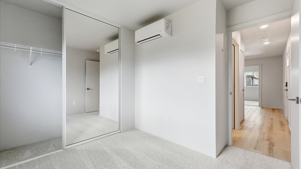 Interior bedroom with sliding door closet
