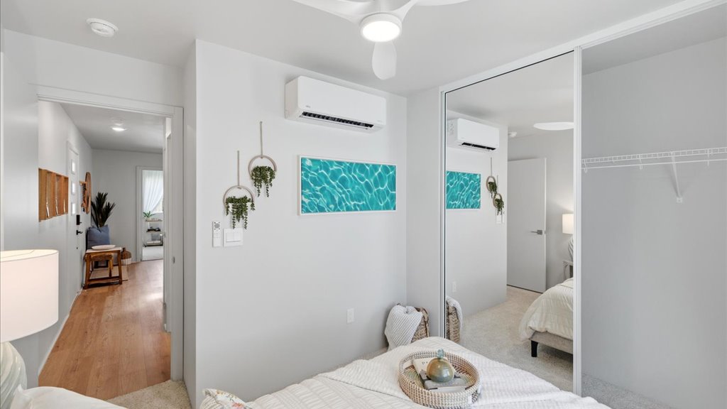 Interior bedroom with mirror sliding door closet