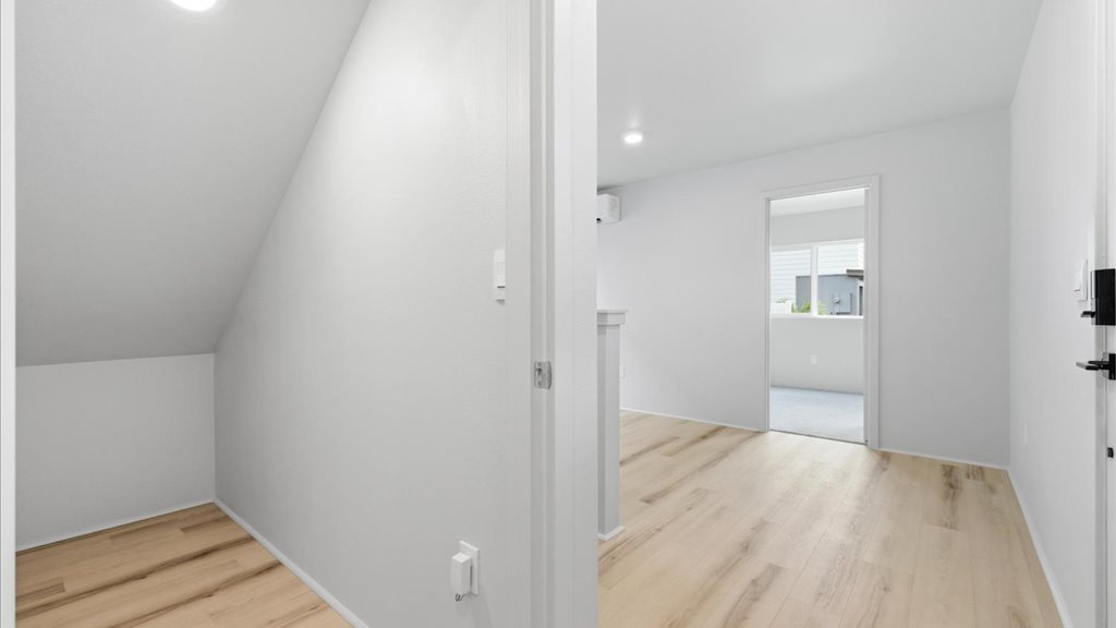 Interior bonus space and play room with large window open to stairs