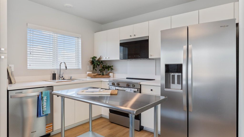 Interior kitchen with stainless steel appliances and stainless-steel island