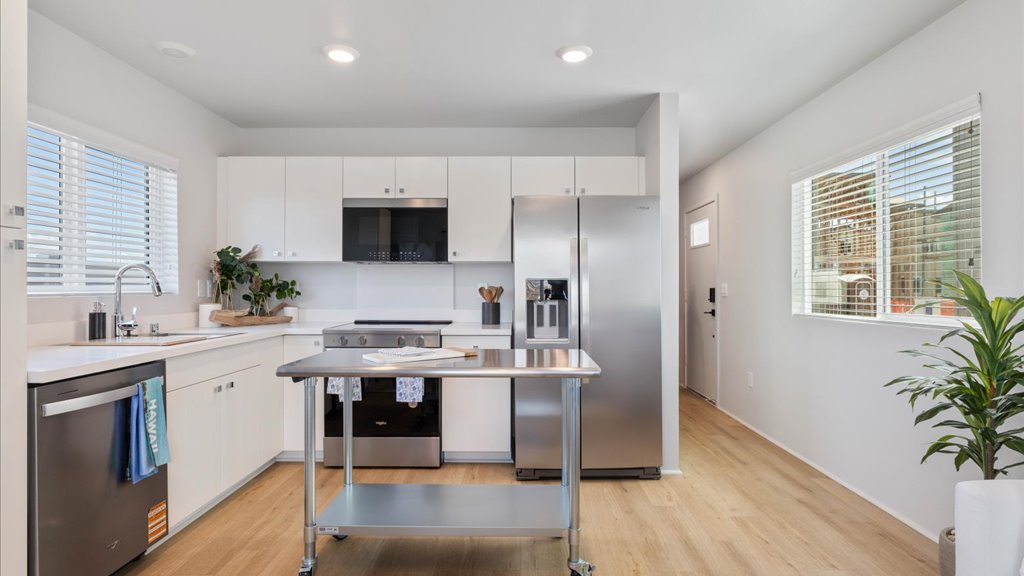 Interior kitchen with stainless steel appliances and stainless-steel island