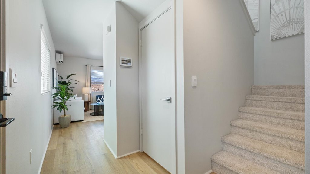 Interior hallway open to bedroom
