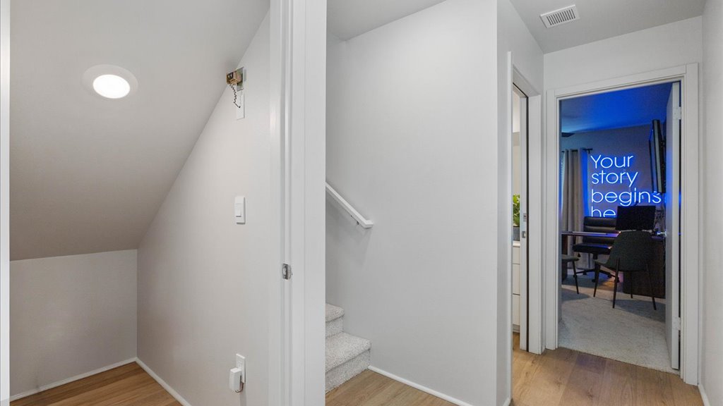 Interior hallway open to bedroom