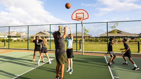 Amenity basketball court with kids playing basketball