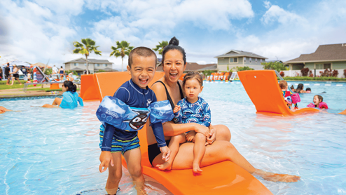 Amenity pool with mother and children in the pool