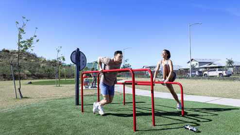 Amenity exercise park with couple exercising