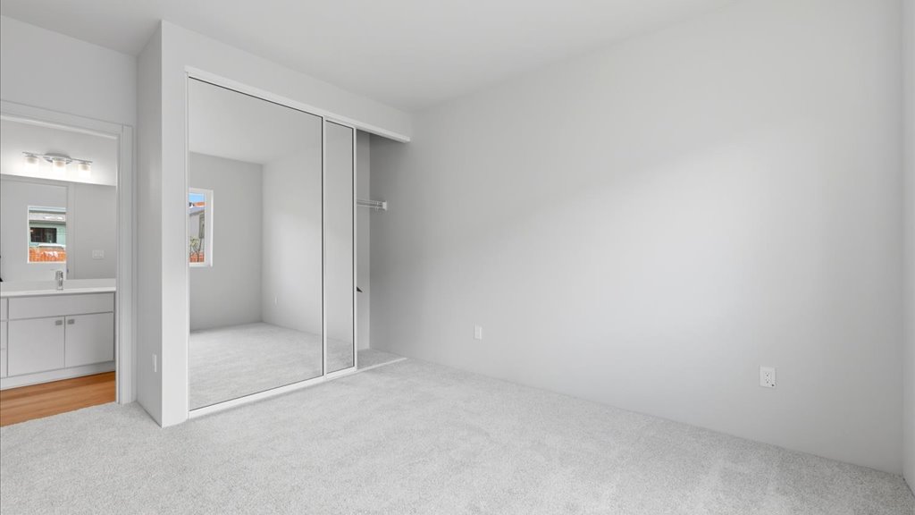 Interior bedroom with sliding closet doors