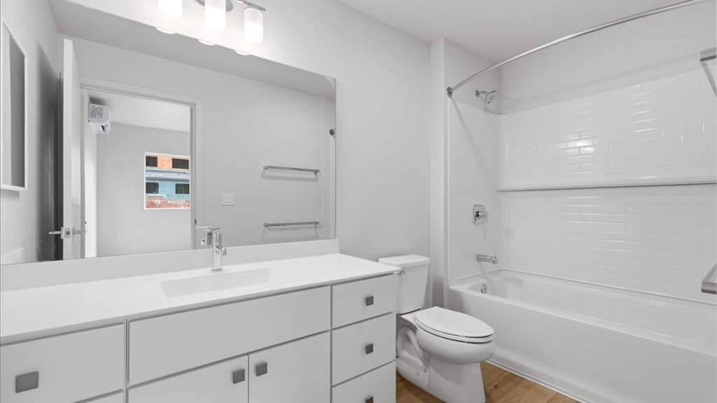 Interior bathroom with vanity sink toilet shower and bathtub
