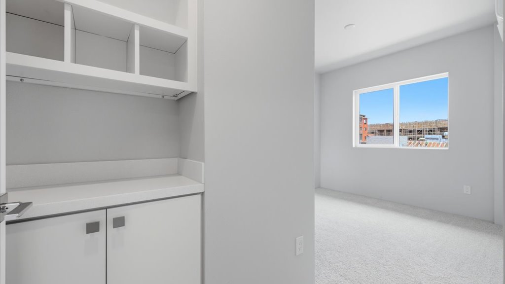 Interior bedroom with built in cabinetry