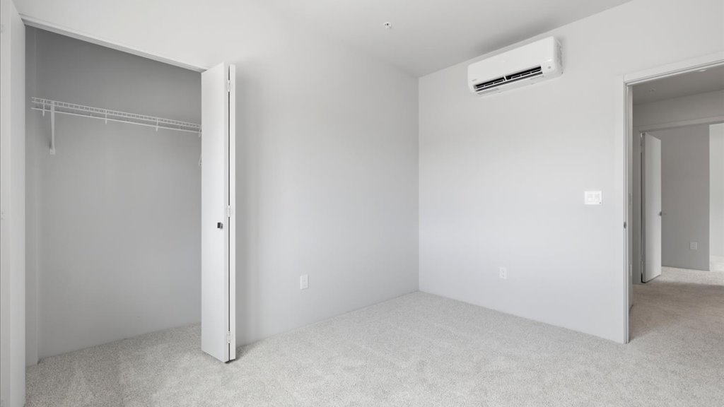 Interior bedroom with sliding closet door