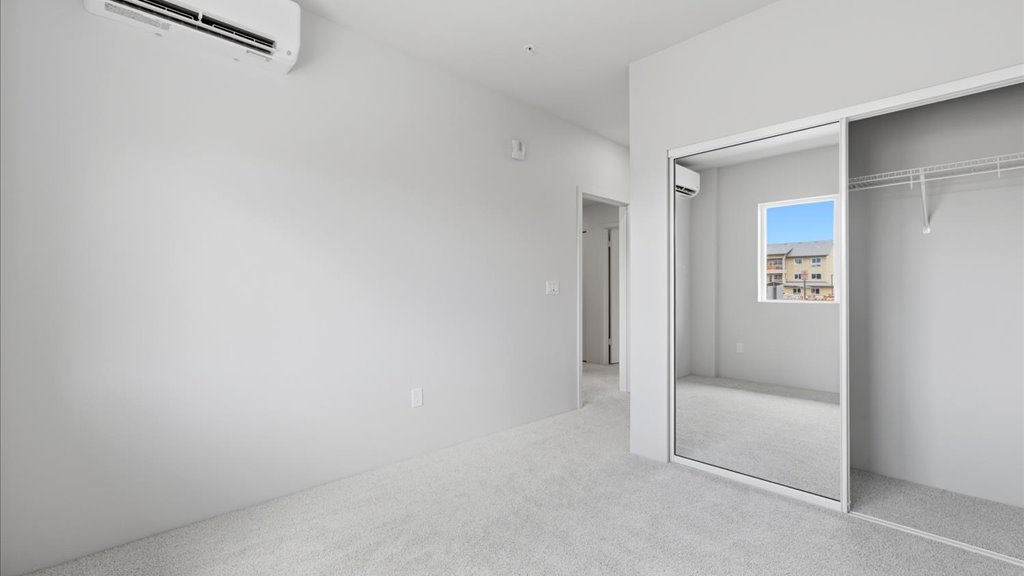 Interior bedroom with sliding closet doors