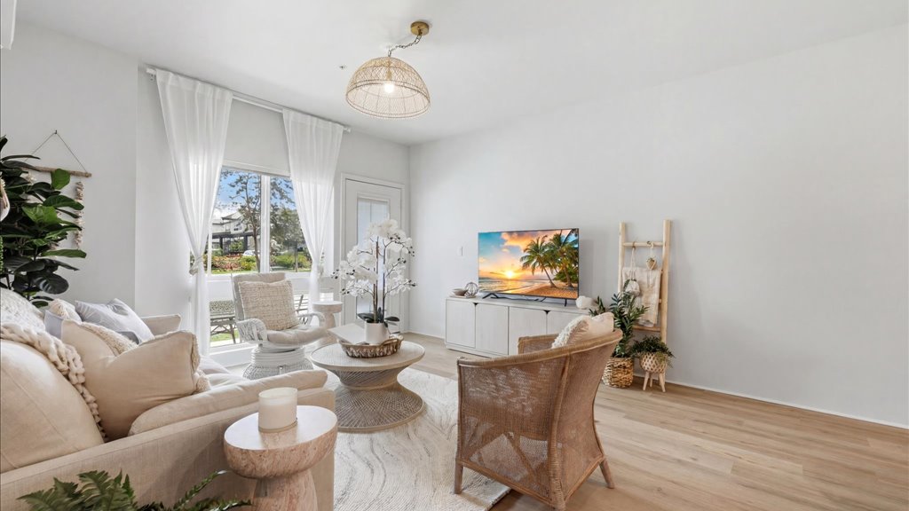 Interior living room open to kitchen and lanai