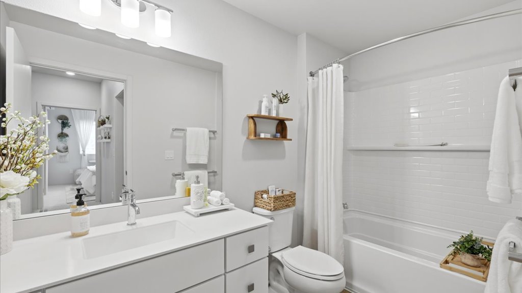Interior bathroom with vanity sink toilet shower and bathtub
