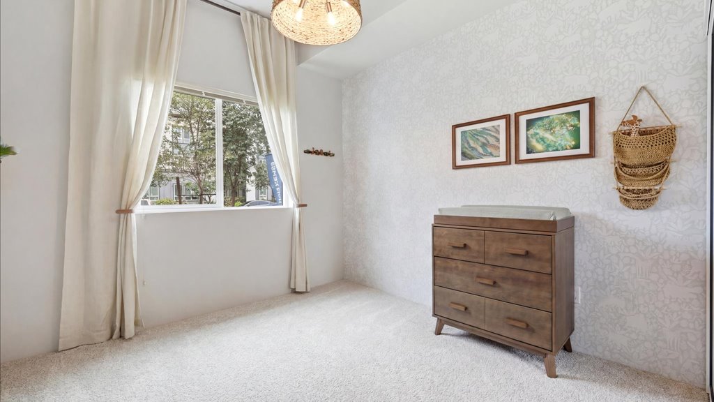 Interior bedroom with sliding door closet and window