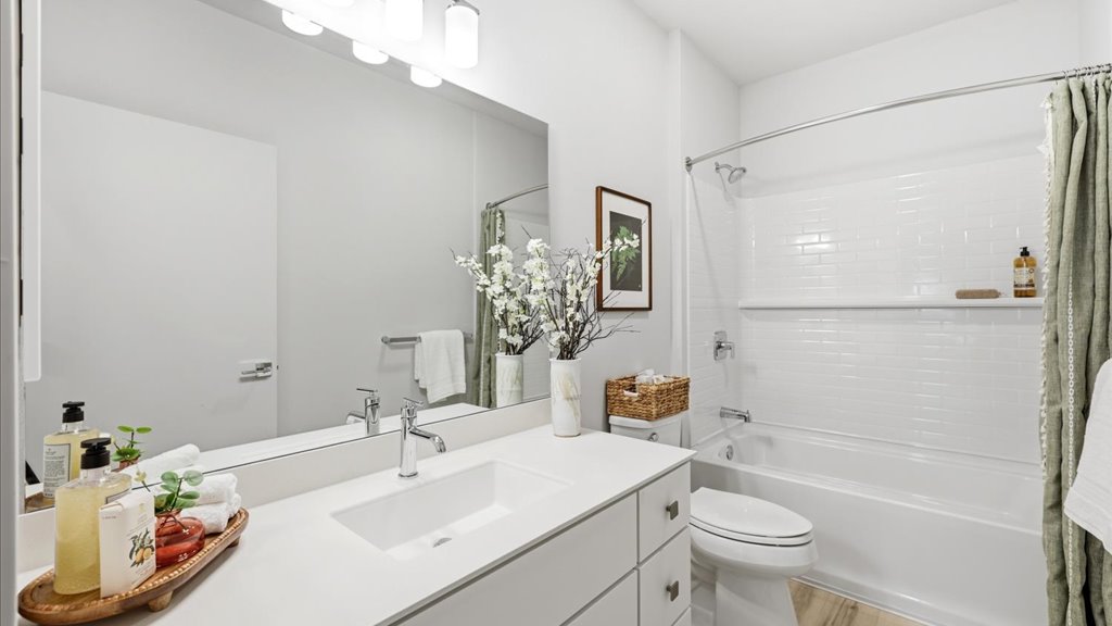 Interior bathroom with vanity sinks and shower tub combination