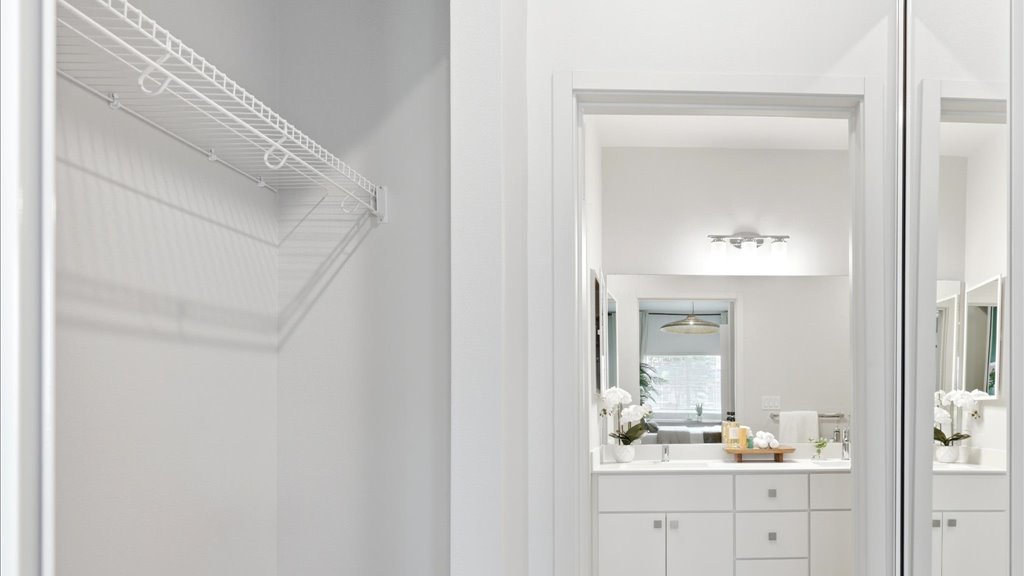 Interior sliding door closet open to bathroom