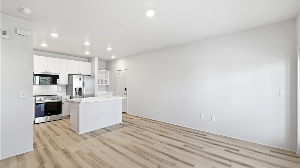 Interior living room open to kitchen and lanai