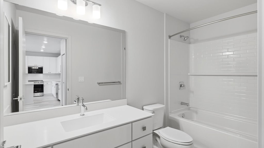 Interior bathroom with vanity sink toilet and shower