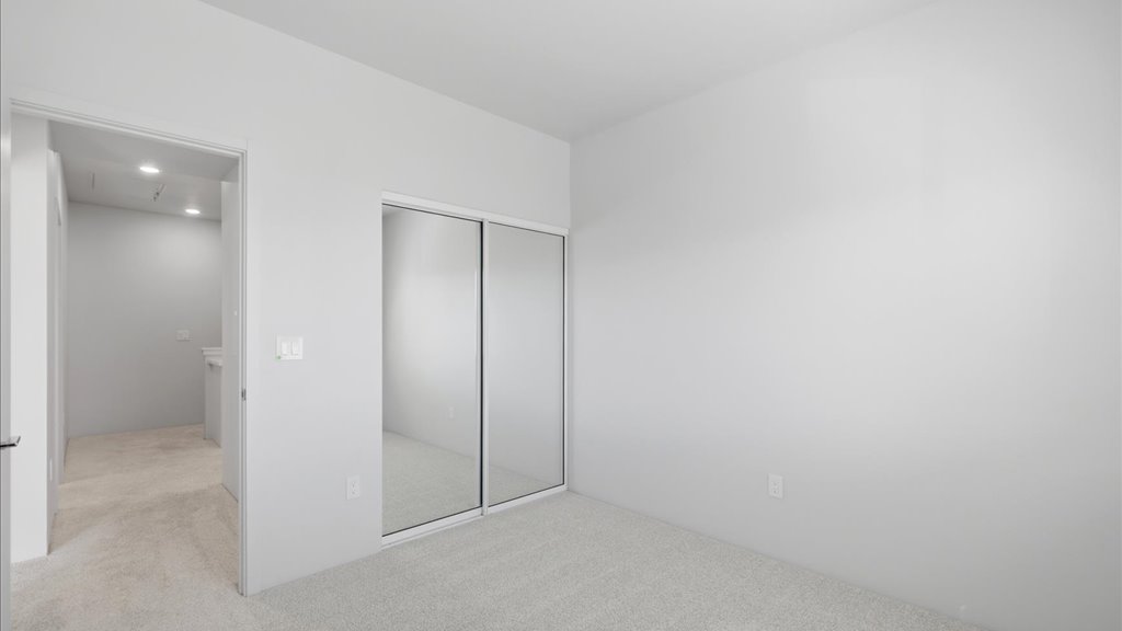 Interior bedroom with sliding door closet