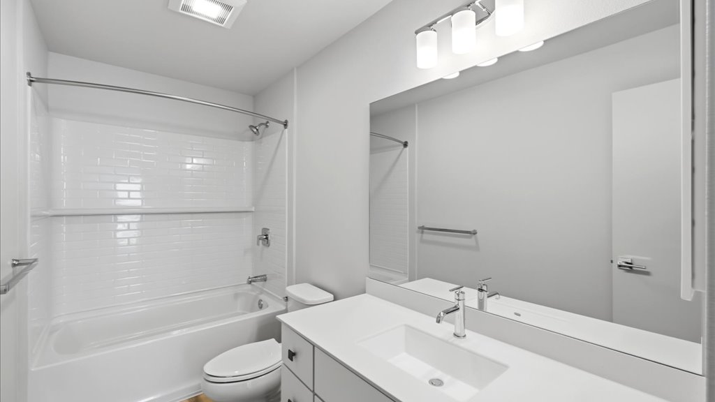 Interior bathroom with vanity sink toilet and shower