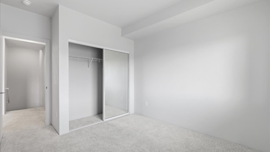 Interior bedroom with sliding door closet