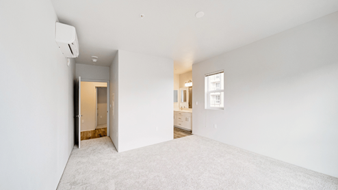 Interior bedroom open to bathroom