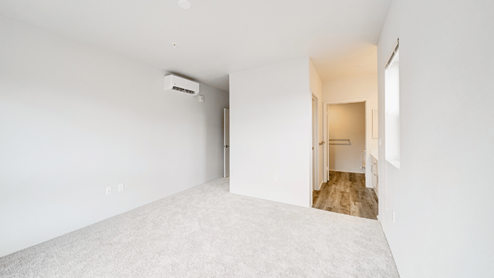 Interior bedroom open to bathroom