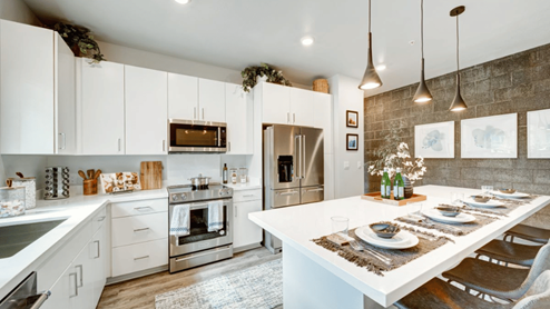 Interior kitchen with large central island and bright lighting
