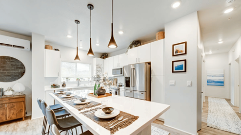 Interior kitchen with large central island and bright lighting