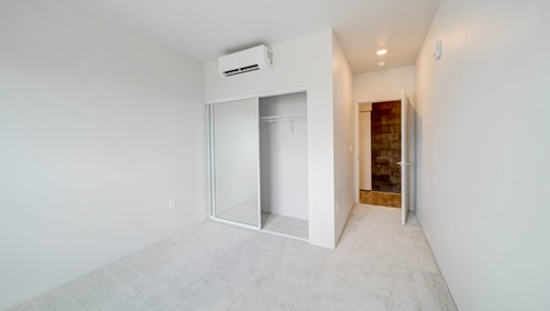 Interior bedroom with full length door mirrors