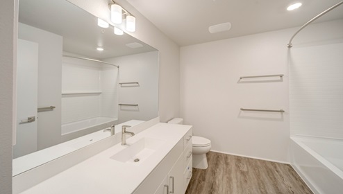 Interior bathroom with toilet and full sized shower
