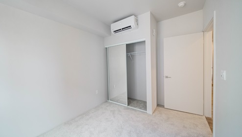 Interior bedroom with full length door mirrors