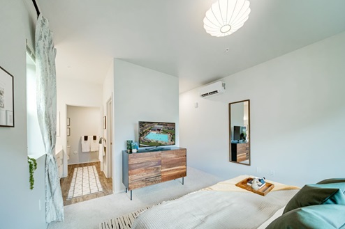 Interior bedroom open to bathroom