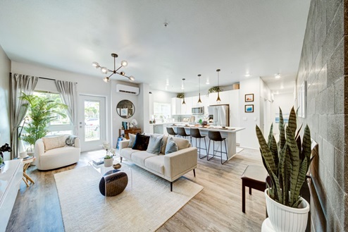 interior Livingroom open to kitchen with bar stools