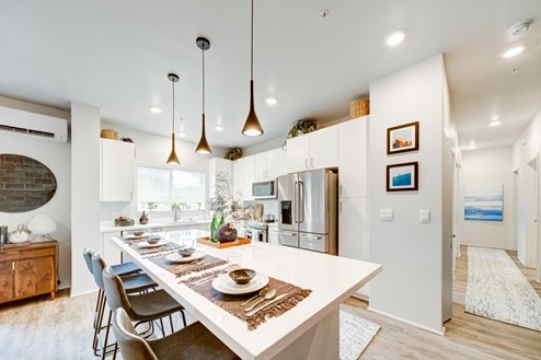 Interior white kitchen with central island
