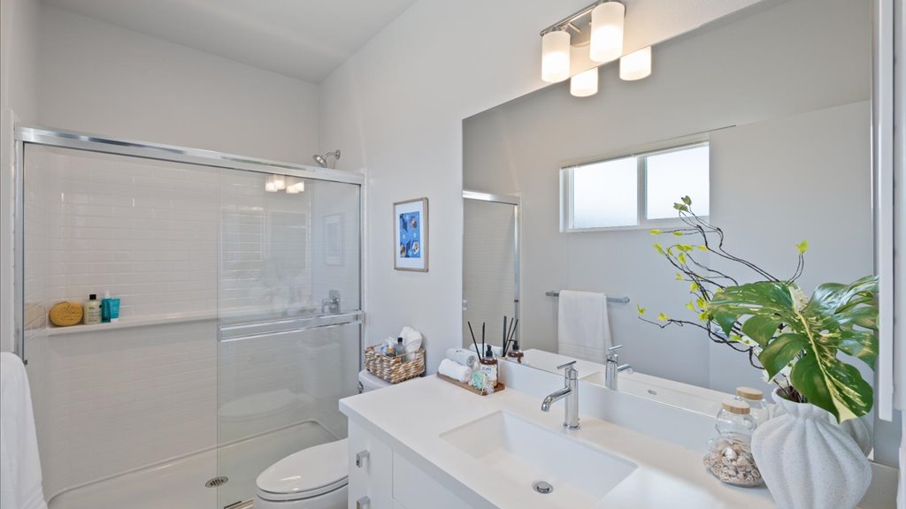 Interior bathroom with vanity sink and toilet and shower