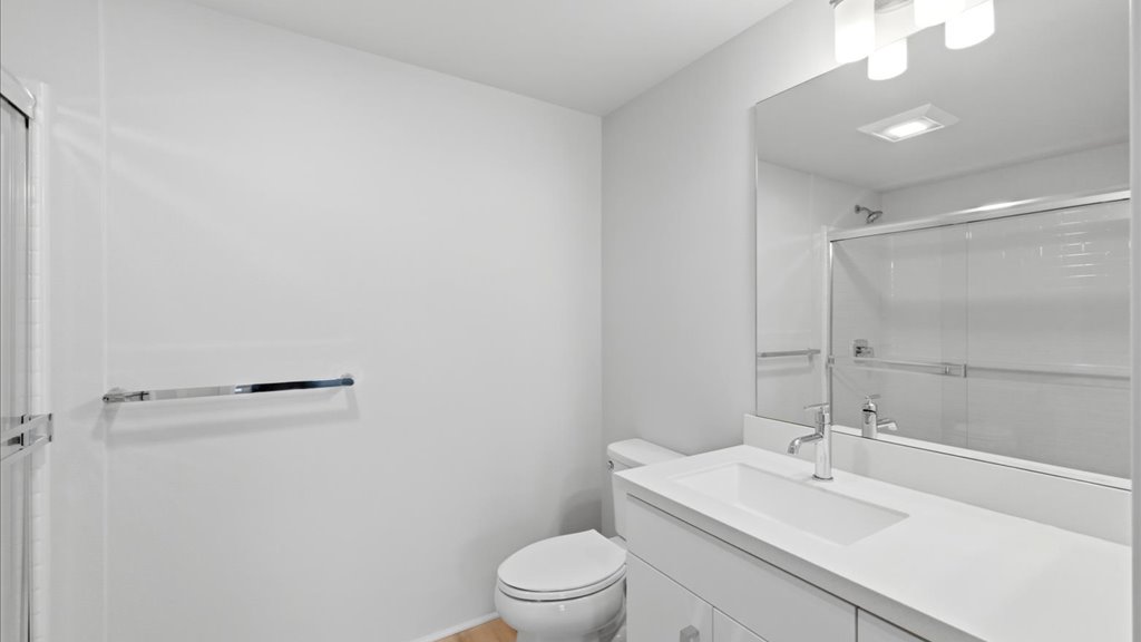 Interior bathroom with toilet and walk in shower