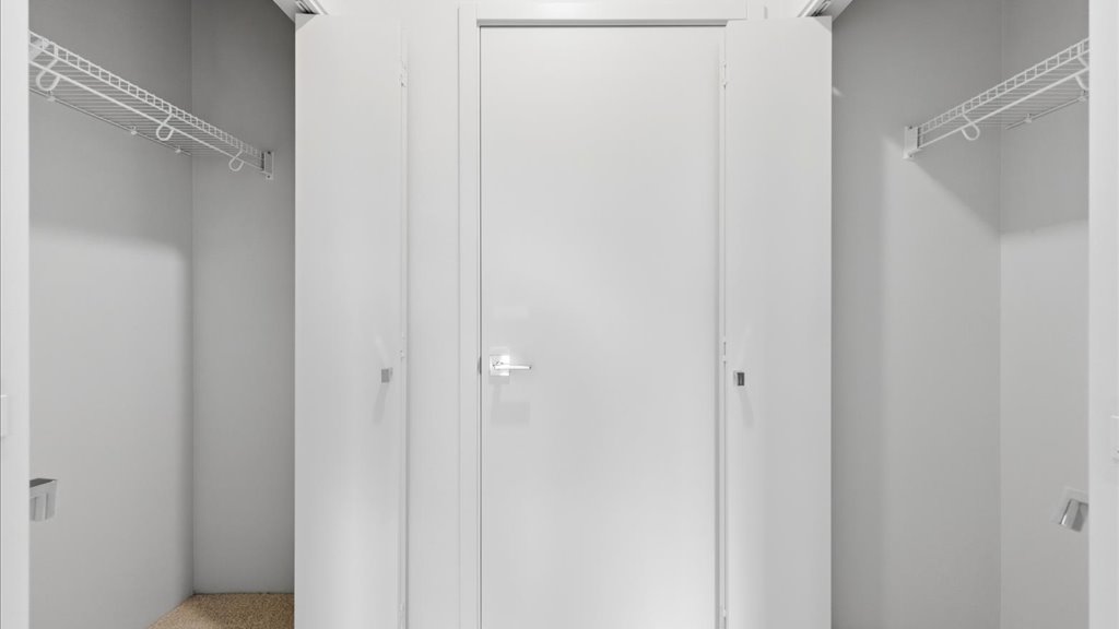 Interior bedroom with his and hers closet