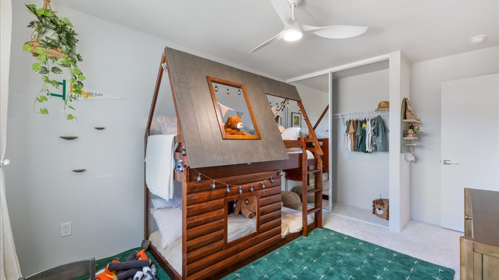 Interior bedroom with large window and sliding door closet