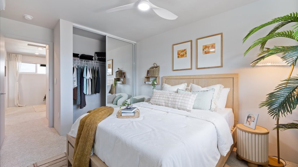 Interior bedroom with large window and walk in closet