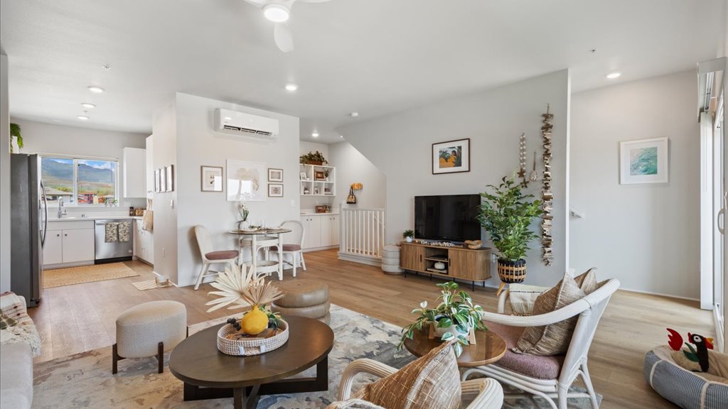 Interior living room that goes into the kitchen with dining area