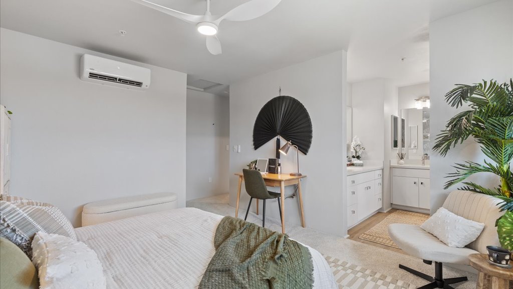 Interior bedroom with walk in closet and ensuite bathroom