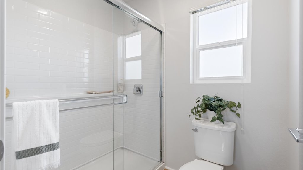 Interior bathroom with vanity sink toilet and walk in shower