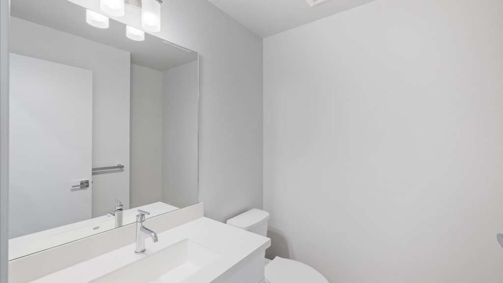 Interior powder room with toilet and sink