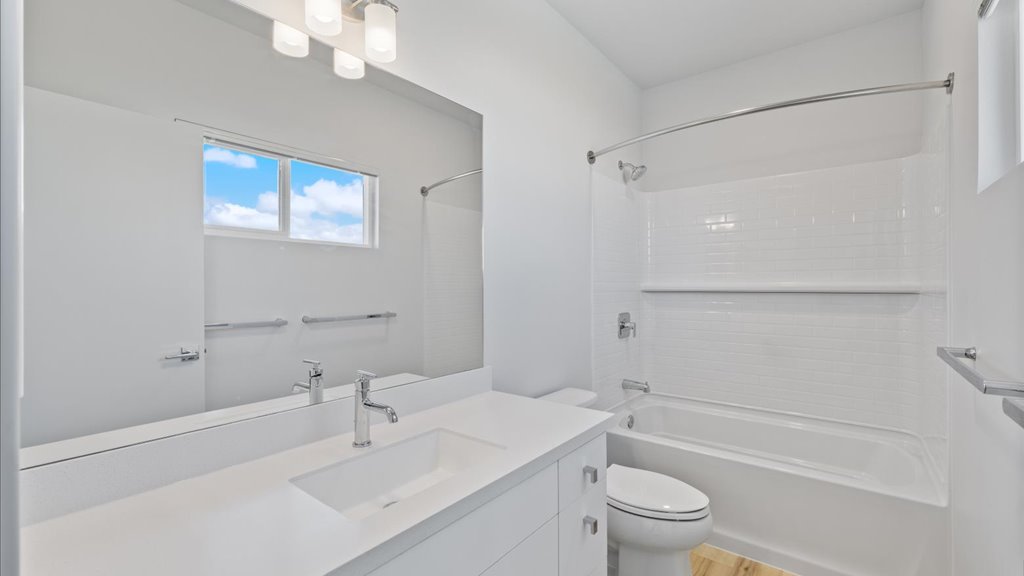 Interior bathroom with toilet and full sized shower