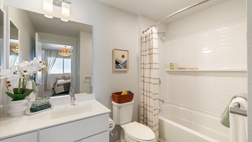 Interior bathroom with vanity toilet and shower tub combination