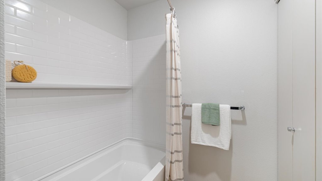 Interior bathroom with vanity toilet and shower tub combination